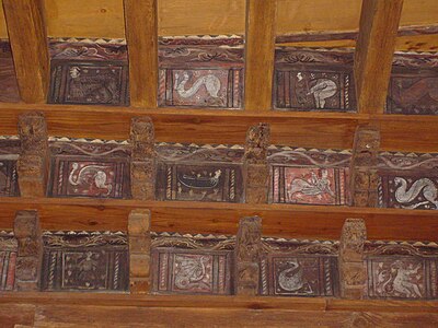 The cloister ceiling is decorated with paintings of 14th-century animals, people and mythical creatures (click image to enlarge)