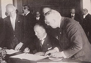 Mussolini signing the Four-Power Pact