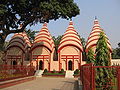Image 62Dhakeshwari Temple is a famous state-owned Hindu temple in Dhaka, Bangladesh built in the 12th century. The temple is located southwest of the Salimullah Hall of Dhaka University. This image shows Shiva temple structures inside the Dhakeshwari Temple complex. Photo Credit: Ragib Hasan