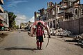 Image 2A man carries a huge hammerhead shark through the streets of Mogadishu
