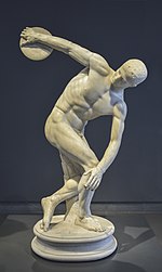 Marble statue of a nude man, crouched in the act of throwing a discus.