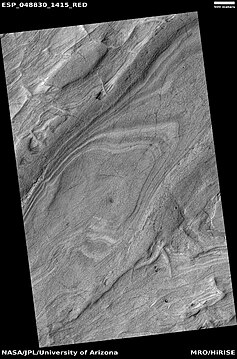 Layered features on floor of Hellas Planitia, as seen by HiRISE under HiWish program This may be an example of honeycomb terrain that is not yet completely understood.