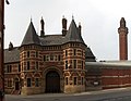 The French Gothic gatehouse of Strangeways Prison by Alfred Waterhouse.