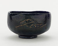 Tea bowl with designs of pine boughs and interlocking circles, unknown raku ware workshop, Kyoto, Edo period, 18th–19th century