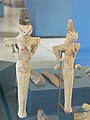 Two lizard-headed female figurines with bitumen headdresses discovered in Ur (dated to the Ubaid IV phase c. 4500 – c. 4000 BCE).