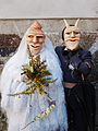A bride and her groom in the carnival of Lazarim, Portugal