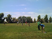 Vrugt (in green) playing softball with UC Irvine engineering faculty and students at annual Water & Environmental Engineering Picnic