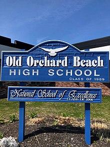 Exterior of OOBHS, showing blue sign that says OLD ORCHARD BEACH HIGH SCHOOL