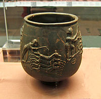 Romano-British beaker with barbotine decoration depicting chariot-racing