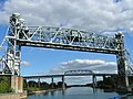Located only about 400 m (1,312 ft) south of the St-Laurent Railway Bridge, on the same line, is a pair of vertical-lift bridges to carry the rail line over the Saint Lawrence Seaway