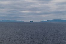 Umnak, Bogoslof and Unalaska Islands as seen from the Bering Sea looking south. Unalaska Island is on the left, Bogoslof Island is in the center, and Umnak Island is on the right.