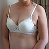 Woman wearing a white lace bra