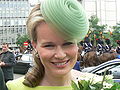 Queen Mathilde of Belgium wearing a light green fascinator