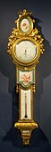 Louis XVI style barometer-thermometer; c. 1776; soft-paste Sèvres porcelain, enamel, and ormolu; height: 1 m, width: 0.27 m[101]