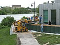 Using a skid loader to fill barriers