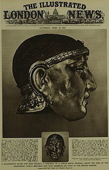 Cover of the edition of 30 April 1955 of The Illustrated London news, in black and white, with a photograph of the dexter side of the Emesa helmet taking up more than half the page, beneath which is a small photograph of the front, and a few paragraphs of text