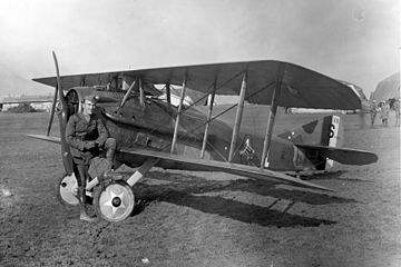 Eddie Rickenbacker with SPAD XIII (note the "Hat in the Ring" 94th Aero Squadron insignia), France, 1918