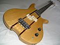 Electric bass guitar with bird's eye maple top