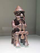 A statuette of a seated man