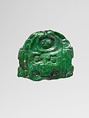Jadeite deity face pendant, 7th–8th century (Metropolitan Museum of Art)