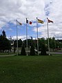 The Republic of Madawaska flag (left), flies along with the Acadian, New Brunswick and Canadian flags in downtown Edmundston, New Brunswick.