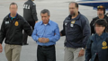 Miguel Rodriguez-Orejuela is escorted by DEA agents after being extradited to the United States.