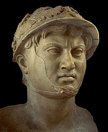 A bust of a man donned in a wreathed helmet.