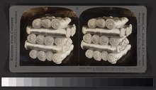 Robert Dennis Collection of Stereoscopic Views. Series numbered 1-25; negatives numbered 20300-20301, 20303, 20304, 20306, 20308-20313, 20315, 20318-20320, 20323, 20325-20332. Views of the silk industry at South Manchester, Connecticut: shows the production of textiles from the opening of bales of raw silk through sorting, washing, combing, spinning, warping, weaving, designing cloth, bleaching, dyeing and printing silk textiles. Neg. 20313