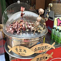 Seafood skewers sold in South Korea: mun-kkochi (giant octopus), sora-kkochi (horned turban), and jju-kkochi (webfoot octopus).