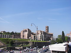 Olivetan monastery behind the apse and bell-tower with outer columns of the former Temple of Venus and Roma.
