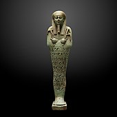 Ushabti; 360–343 BC; ceramic and enamel; 26.7 × 7.1 cm; from Saqqara; Museum of Art and History (Geneva, Switzerland)