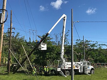 Western Area Power working for USACE, transferring the conductors from the damaged 38-kV transmission pole November 2017