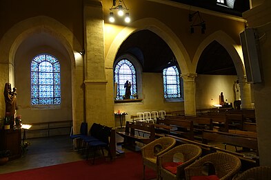 Collateral aisle and stained glass