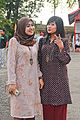 Two Malay women wearing Baju Kurung
