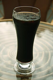 Glass of dark liquid