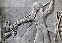Ashurbanipal II hunts a lion. Bas-relief from his north palace at Nineveh, Iraq. 7th century BC. The Pergamon Museum.