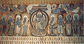 Buddha flanked by bodhisattvas with flying apsaras. Dunhuang mural. Cave 428, Northern Zhou dynasty