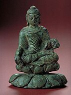 A statuette of the Buddha sitting in the lotus position