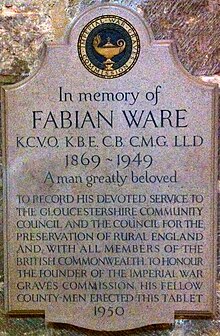a plaque that reads "In memory of Fabian Ware KCVO, KBE, CB, CMG, LLD 1869–1949 A man greatly beloved To record his devoted service to the Gloucestershire community council and the council for the preservation of rural England and, with all the members of the British Commonwealth, to honour the founder of the Imperial War Graves Commission, his fellow county-men erected this tablet 1950