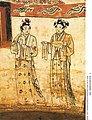 Women possibly wearing shanqun (upper garment over skirt) and beizi (Song-style clothing), inner chamber of the Tomb of Zhang Kuangzheng, Liao dynasty. The hairstyle is Khitan-style.[8]