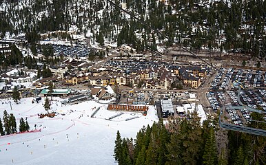 An elevated view of the village and some of the lifts at Palisades Tahoe