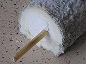 a section of Sainte-Maure de Touraine cheese