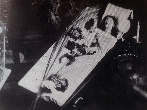 Bernhardt in her famous coffin, in which she sometimes slept or studied her roles (c. 1873)