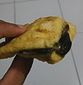 Tahu petis. Fried tofu filled with petis (black colored shrimp paste sauce). Originated from Semarang, Central Java.