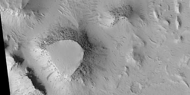 Mesas, as seen by HiRISE under HiWish program. Top layer, the cap rock is breaking up into boulders.