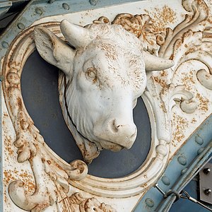 Neoclassical ox mascaron on the Halles centrales de Dijon, designed by Louis-Clément Weinberger, 1873-1875
