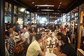 Interior of Mercado de San Miguel showing people meeting for tapas and drinks