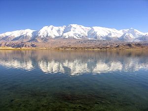 Kongur Tagh (towards the right edge of the photo) and Kongur Tiube (center) as seen from lake Karakul