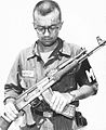 A U.S. Army M.P inspects a Chinese AK-47 recovered in Vietnam, 1968
