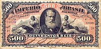 Photograph of a banknote containing a picture of a bearded man in the center and the number 500 printed in the corners